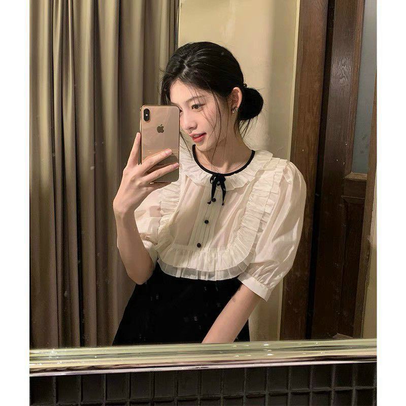 Đầm đen phối trắng cổ bèo nơ thắt