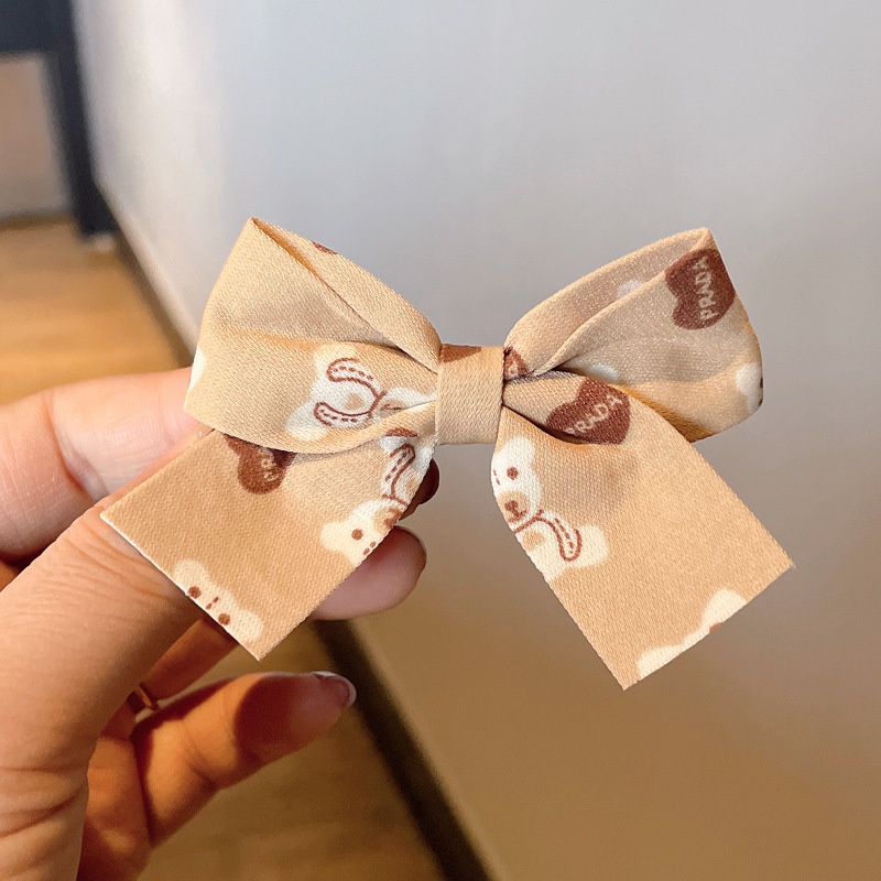 Kẹp tóc hình nơ màu đỏ sữa cà phê xinh xắn cho bé gái