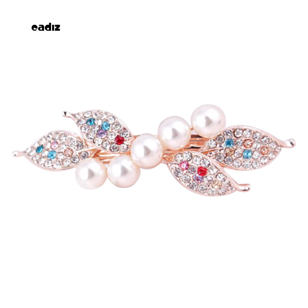 Kẹp tóc nơ đính hạt giả ngọc trai