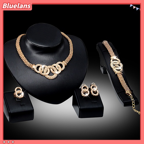 Bộ trang sức gồm 1 dây chuyền + 1 vòng đeo tay + 1 nhẫn + đôi khuyên tai tạo hình vòng nối đính đá thời trang