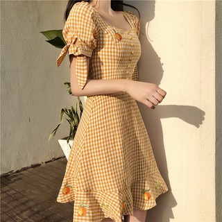 Đầm sọc ca rô vàng trái cam