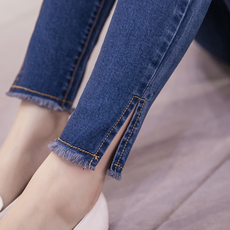 Quần jean dáng ôm thiết kế xẻ hai bên ống quần phong cách Hàn Quốc cá tính cho nữ
