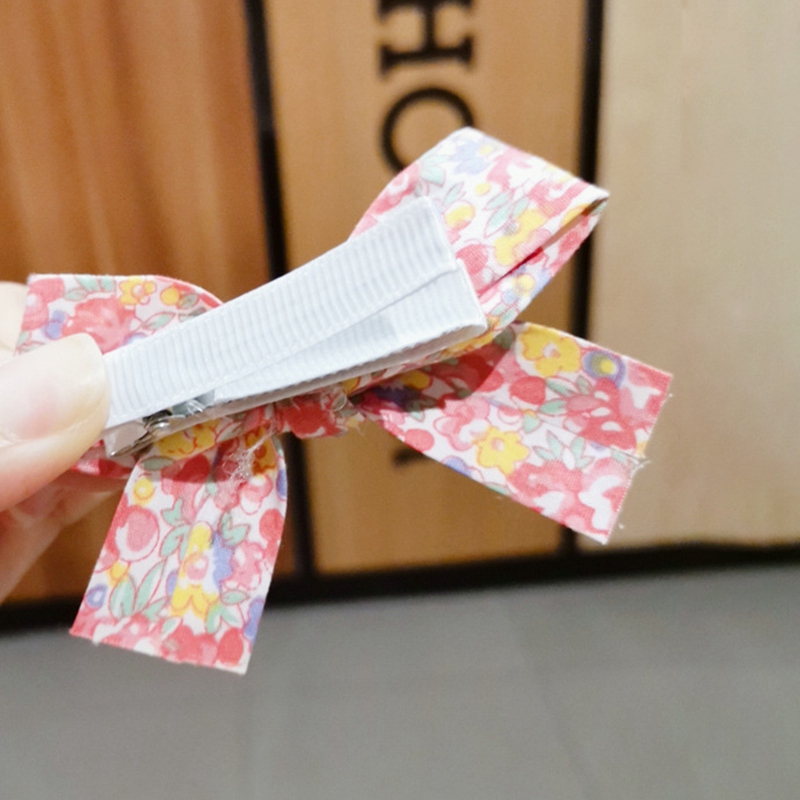 Kẹp tóc đính nơ họa tiết nhiều màu phối kim loại an toàn dành cho bé