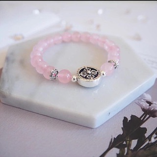 Vòng tay hồng mix charm bánh xe pháp luân