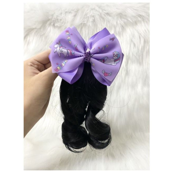 Kẹp nơ tóc xoăn cho bé