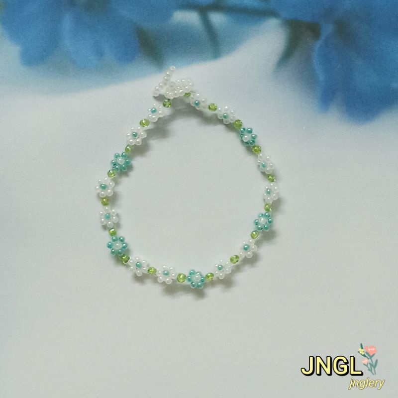 Vòng tay hạt cườm gạo kết hoa màu tím mã TK501