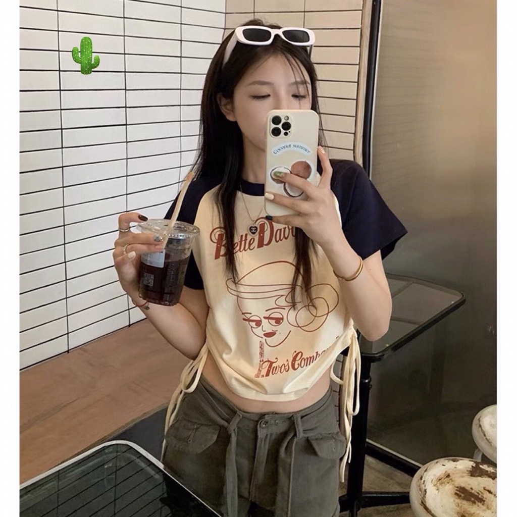 Áo kiểu croptop màu kem tay xanh in chữ logo trước rút dây 2 bên cực xinh , chất thun bozip mềm mịn