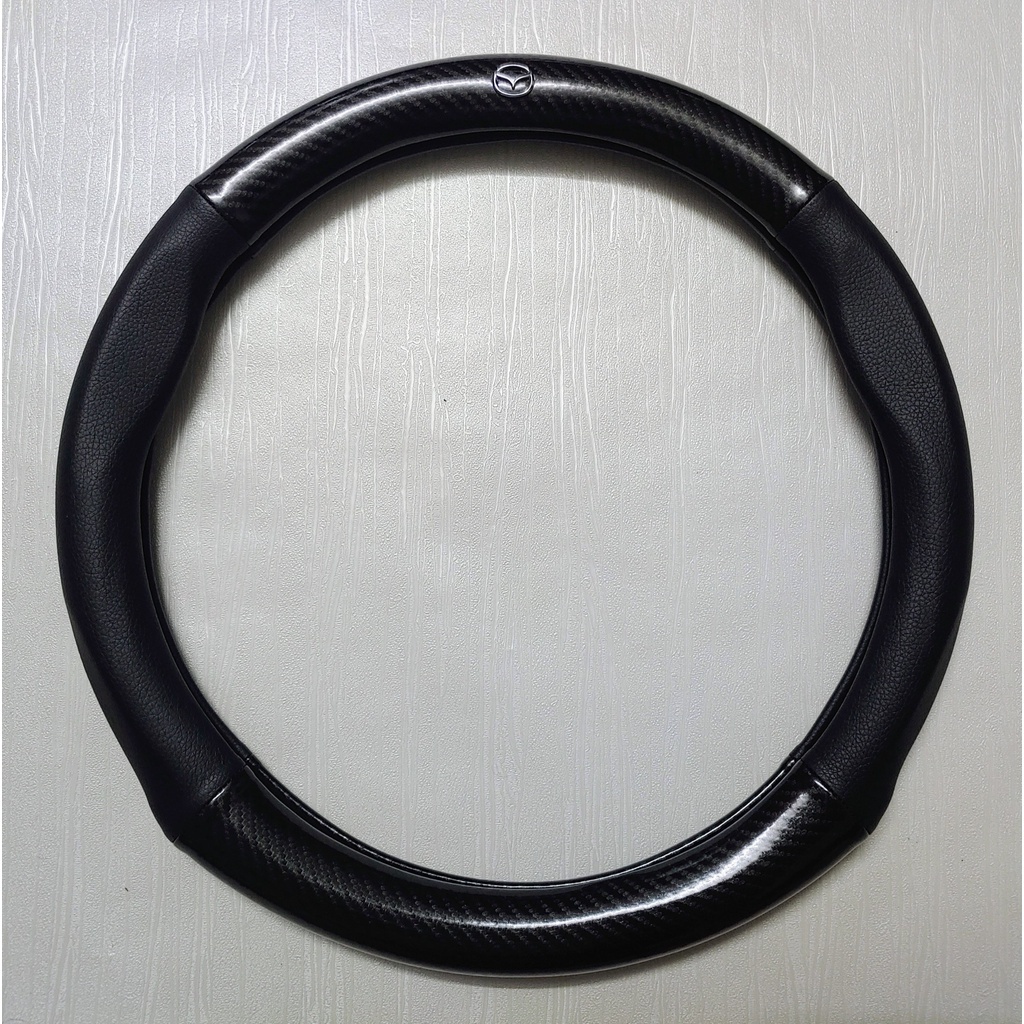 Bọc vô lăng MAZDA 2 Mazda 3 Mazda 6 CX5 BT50 CX8 CX30 chất liệu da vân cacbon đục lỗ thoáng khí