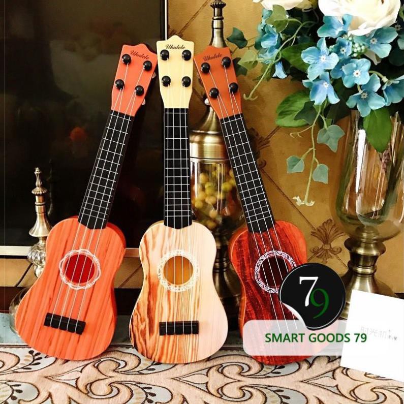 Đàn ukulele mini, đàn guitar mini cho bé tặng kèm vỏ đựng