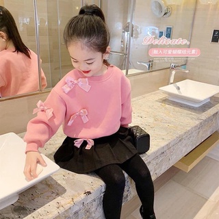 Áo da cá gắn nơ nhỏ xinh bé gái