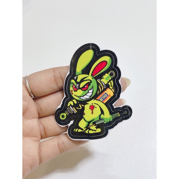 Tem dán hình thỏ điên cầm phuộc Olin, thỏ tay cầm trợ lực kích thước 6x5cm có sẵn keo dán