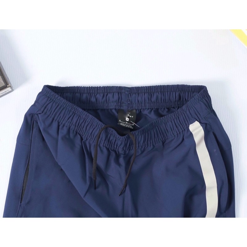 Quần jogger nam thể thao thiết kế sọc phản quang chất vải si dù