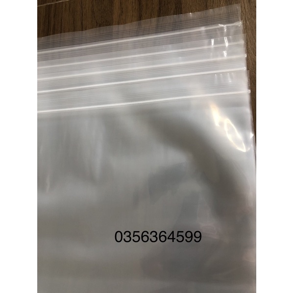 1 chiếc túi zip size lớn có bấm lỗ, đựng quần áo, chăn màn 40x60cm