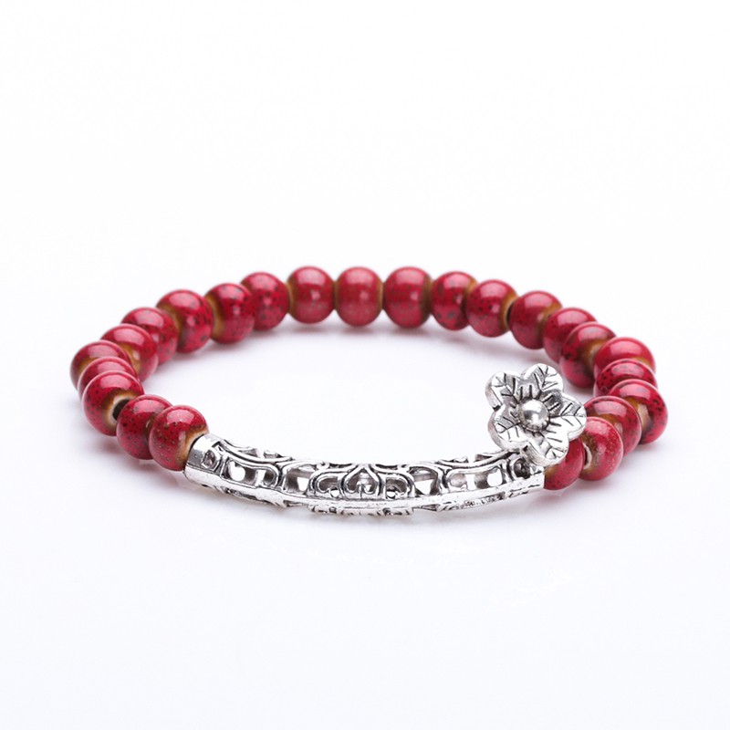 Vòng tay gốm đỏ charm hoa