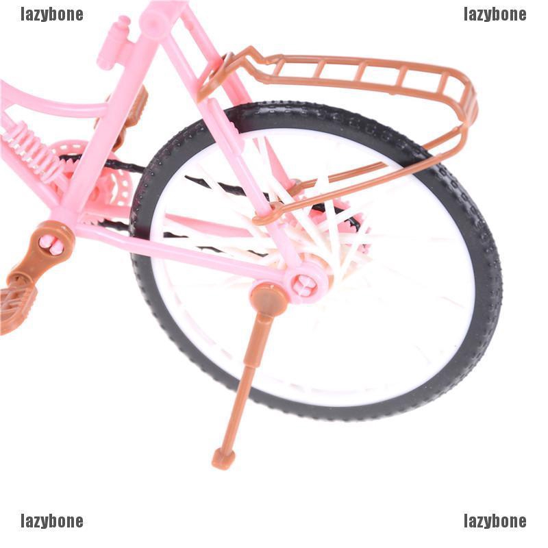 Xe đạp hồng có giỏ cho nhà búp bê