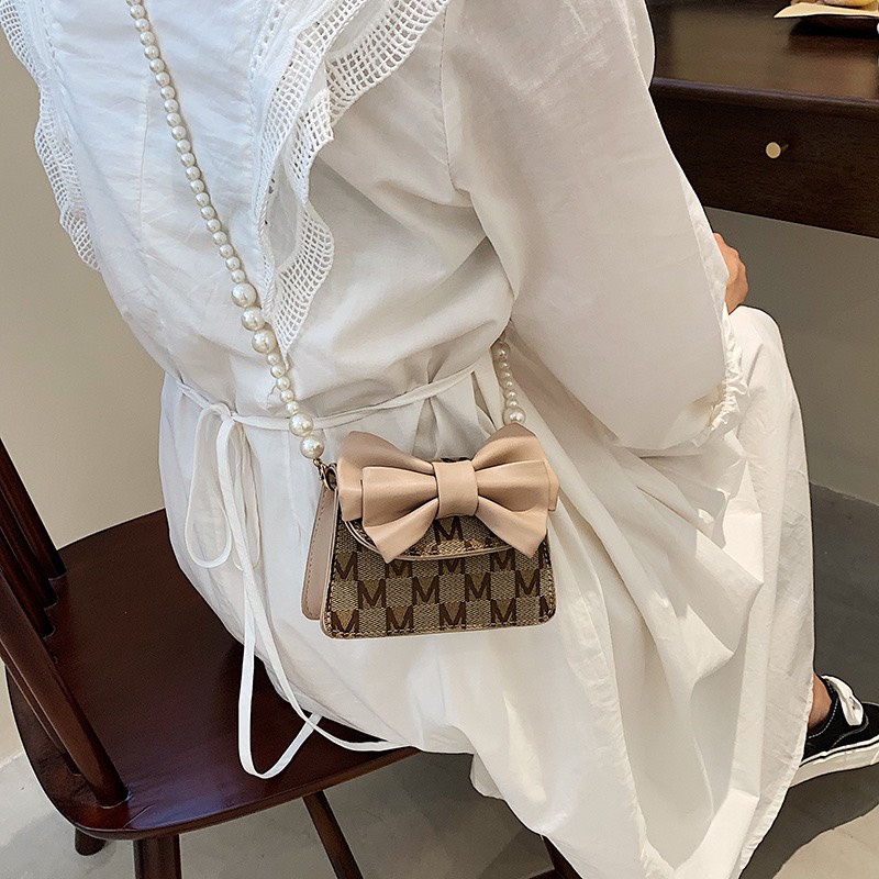 Túi đeo chéo mini đính nơ dây đeo ngọc thời trang mẫu mới 2022