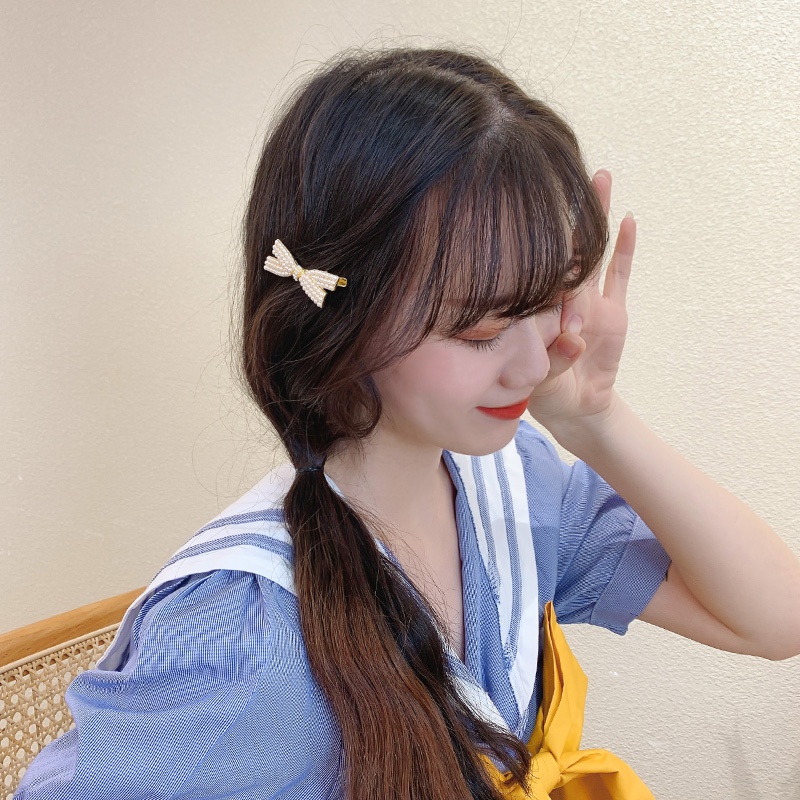 Kẹp tóc hình nơ đính ngọc trai dành cho nữ