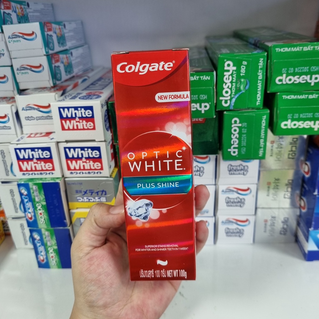 Kem đánh trắng răng COLGATE Optic White Plus Shine 100g [trắng sáng răng sau 1 tuần sử dụng]