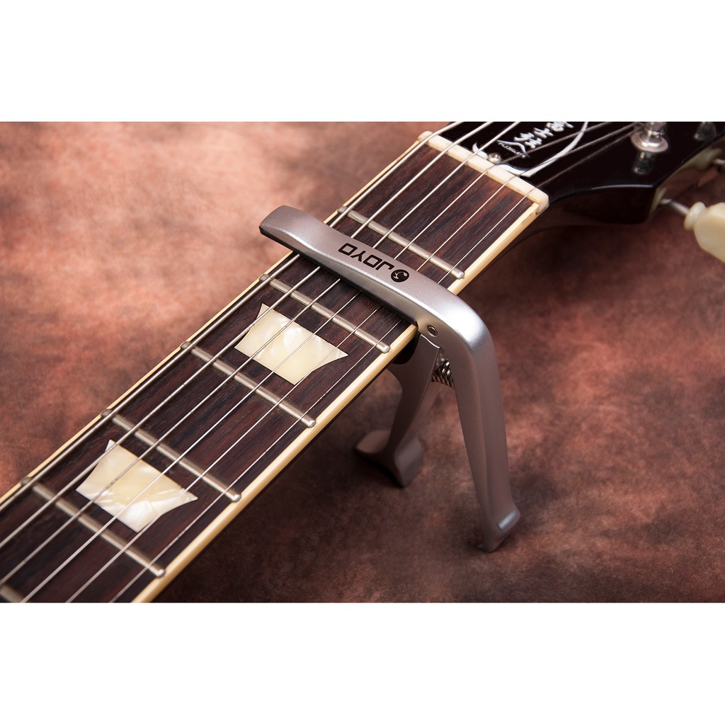 [Chính hãng] Capo guitar cao cấp JOYO JCP02 dùng cho đàn ukulele , guitar acoustic, classic và electric (Tặng kèm pick)