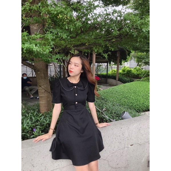 Đầm nơ viền chỉ