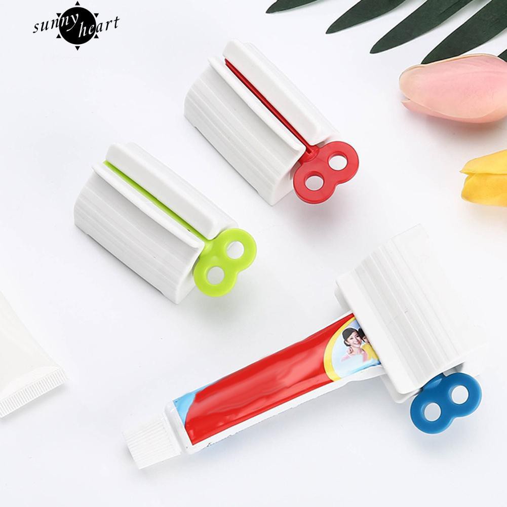 Dụng cụ bóp tuýp kem đánh răng