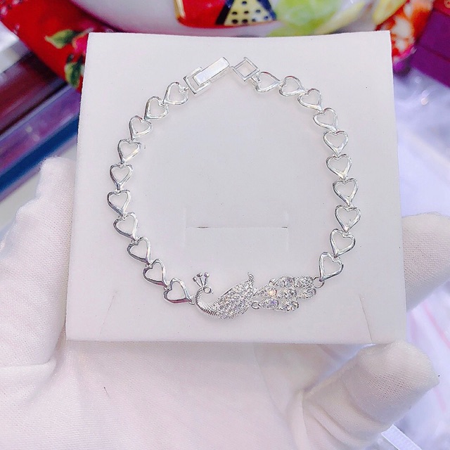 Lắc tay con công quả cầu tim thiên Nga hoa bạc ta