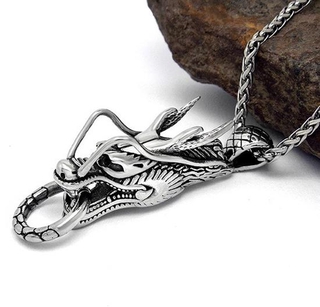 Mặt dây chuyền inox đầu rồng ngậm vòng kim cô
