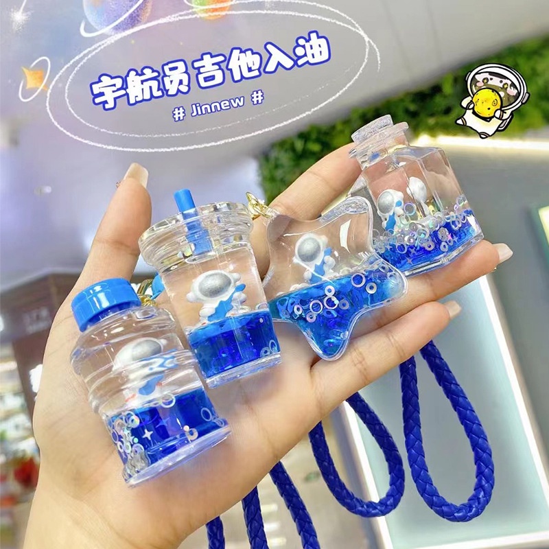 Móc khóa bình nước Phi hành gia xanh dương nhiều kiểu dáng độc đáo làm quà tặng bạn bè người thân móc túi balo -Ráp