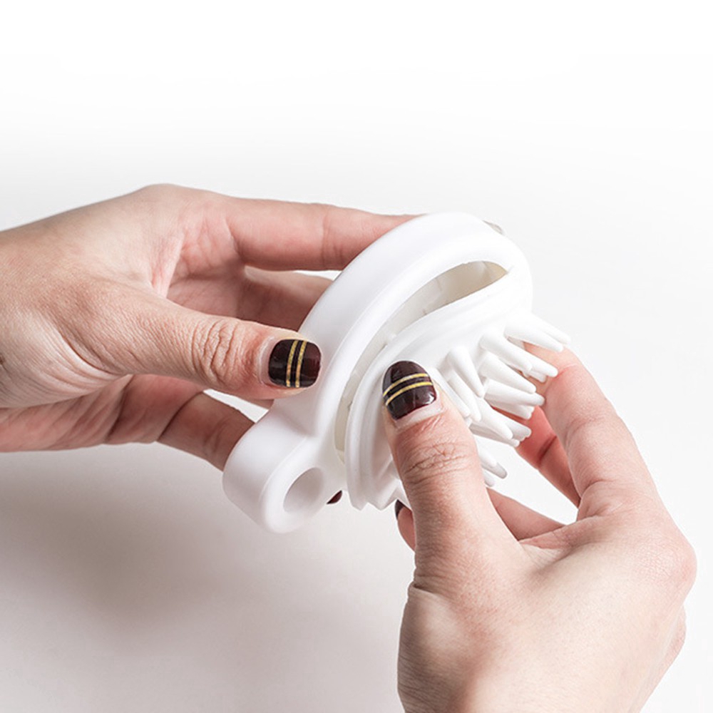 Lược mát xa da đầu mini cầm tay bằng silicon tiện dụng