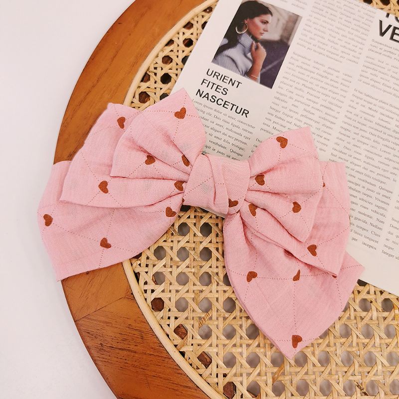 Kẹp tóc nơ họa tiết trái tim bản to