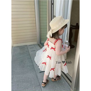 Váy 2 dây đũi trắng đính nơ đỏ