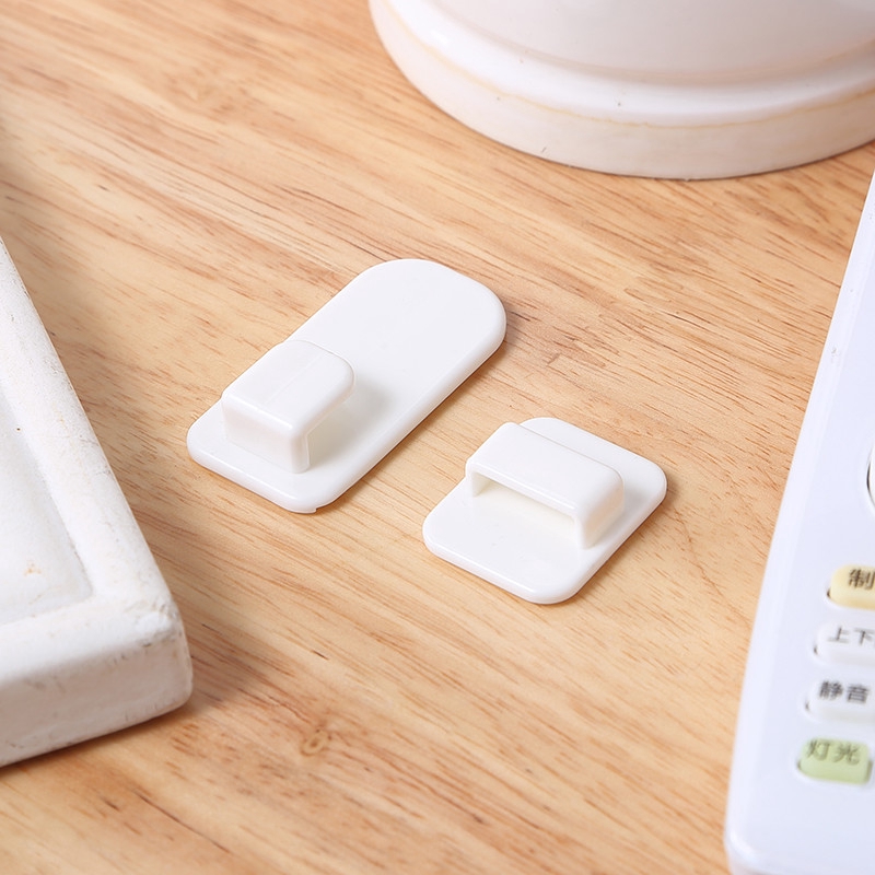 Set 4 móc treo điều khiển từ xa TV/điện thoại bằng nhựa dán tường màu trắng