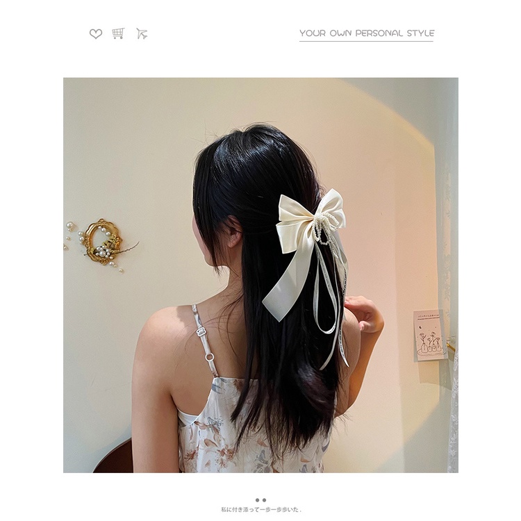 Kẹp tóc cài lông đuôi hươu đen với viền ngọc trai