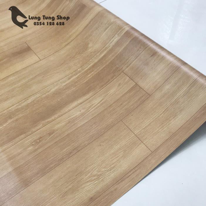 Thảm nhựa simili trải sàn vân gỗ màu vàng bề mặt nhám