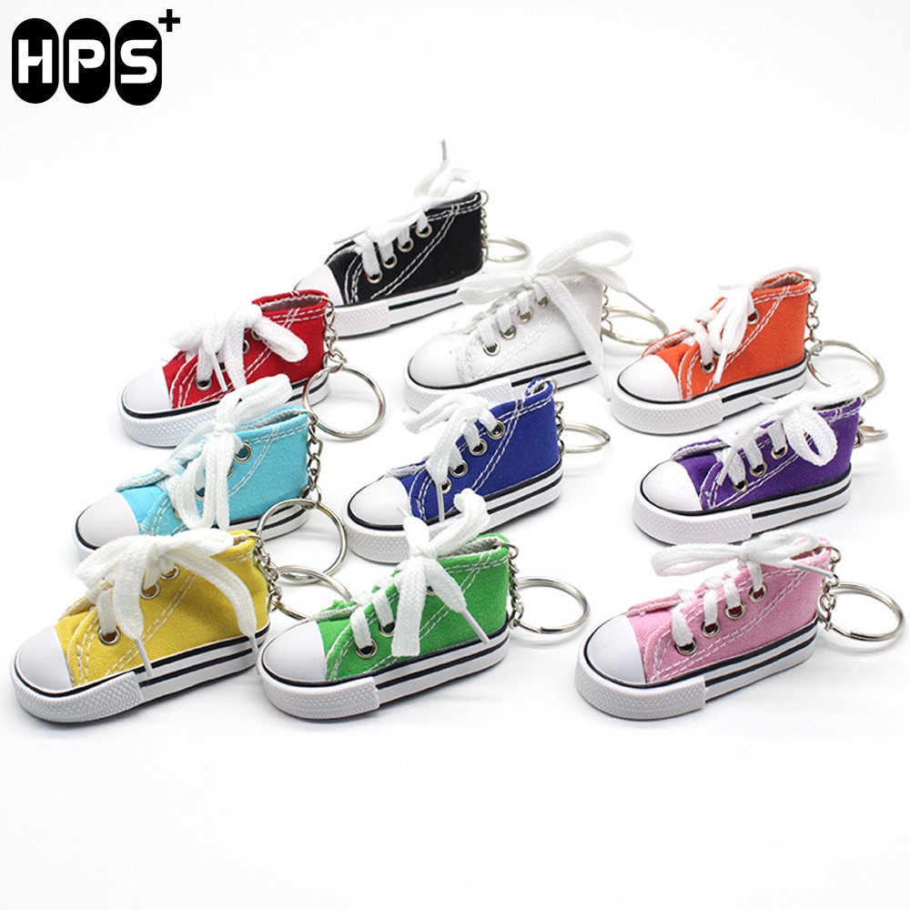 Vỏ bọc chân chống xe máy hình giày thể thao mini vui nhộn