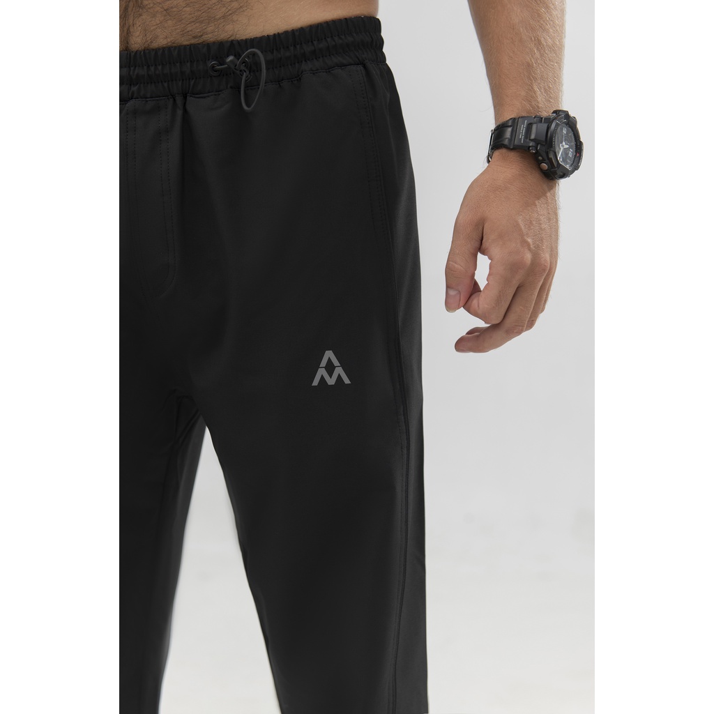 Quần Gió thể thao nam AM QGM211 Sport1 Chất Liệu Mềm Mại, Không Thấm Nước, Không Nhăn