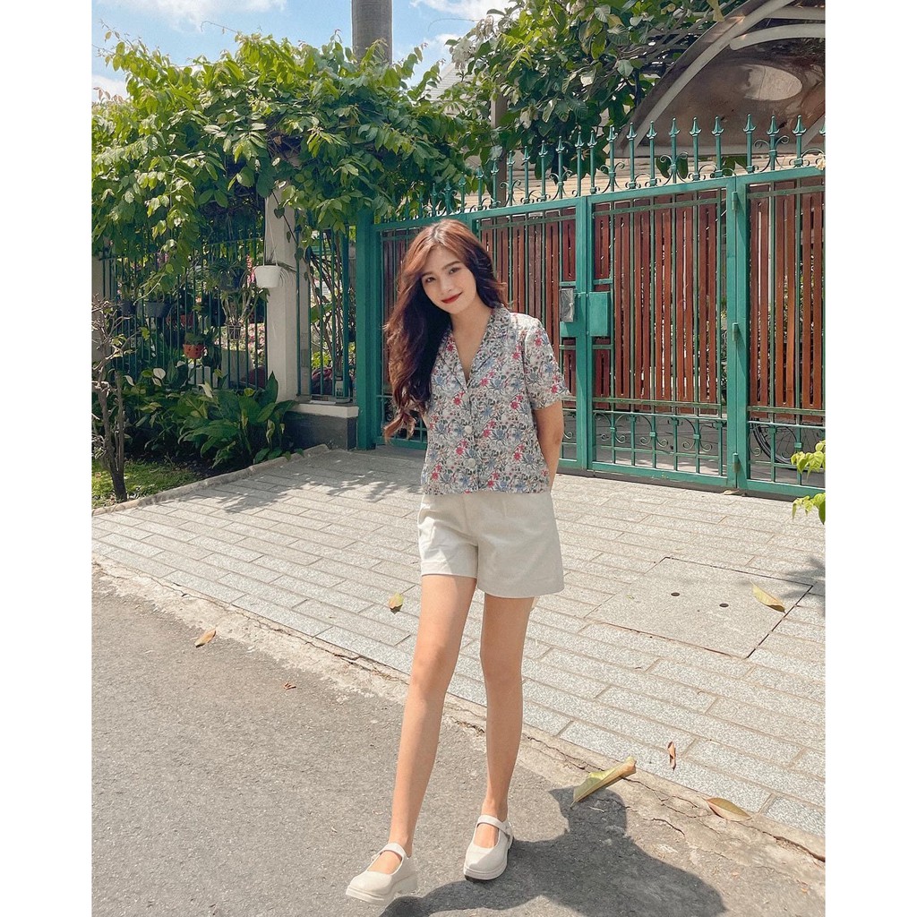 Áo SM hoa nút gỗ freesize Pumi