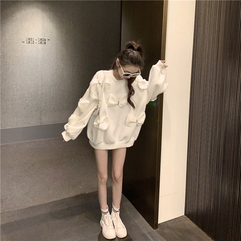 Áo sweatshirt cổ tròn dáng rộng trang trí nơ màu trắng thời trang thu đông Hàn Quốc 2021 cho nữ