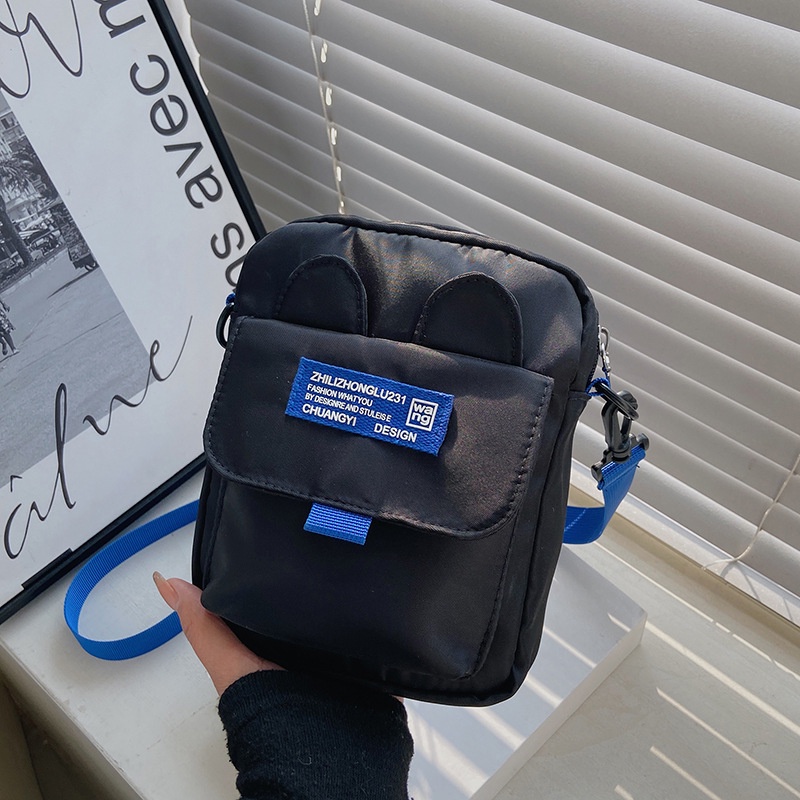 Túi Đeo Chéo Dáng Vuông Nhỏ Chất Liệu Nilon Màu Xanh Dương Mẫu Mới