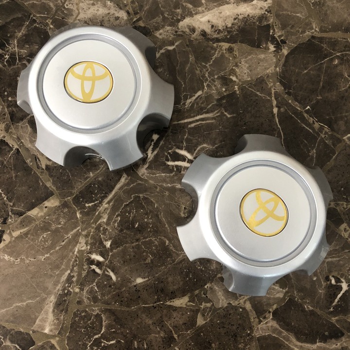 1 chiếc logo chụp mâm, ốp lazang bánh xe ô tô Toyota Land Cruiser Prado đời từ 2002 đến 2009