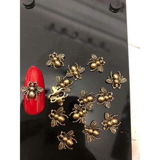 Cham Ong Gucci mầu đồng