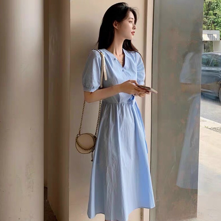 Đầm xanh cổ V dáng xòe thắt nơ eo