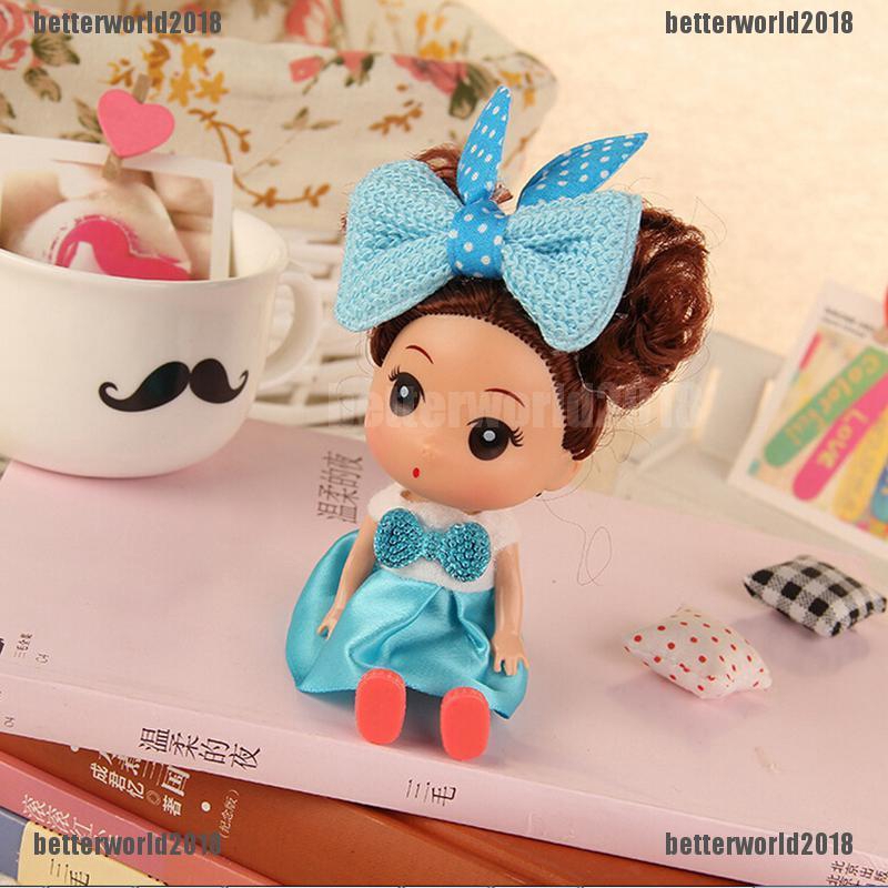 Búp bê mini hình cô bé tóc xù đeo nơ thời trang chiều cao 12cm