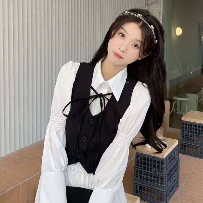 Set áo gile ngắn đen cổ V nữ sinh thắt nơ + váy sơmi trắng dài tay tầng bèo dáng babydoll xinh xắn có size