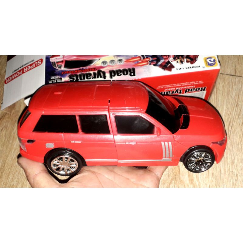 Một chiếc xe chạy pin biến hình thành robot bằng nhựa có nhạc và đèn led rất đep_tặng kèm pin