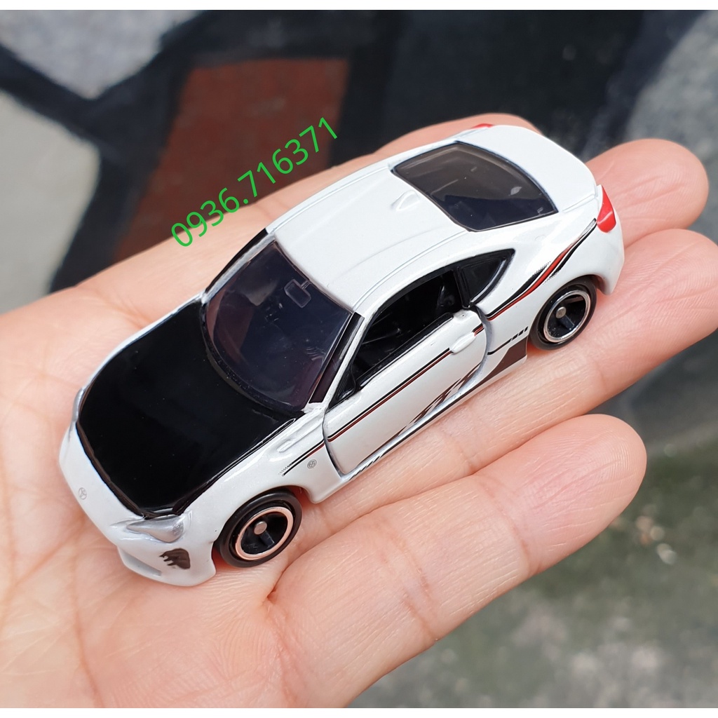 Mô hình siêu xe Toyota màu trắng đen bản Toysrus mở được cửa tomica Nhật Bản