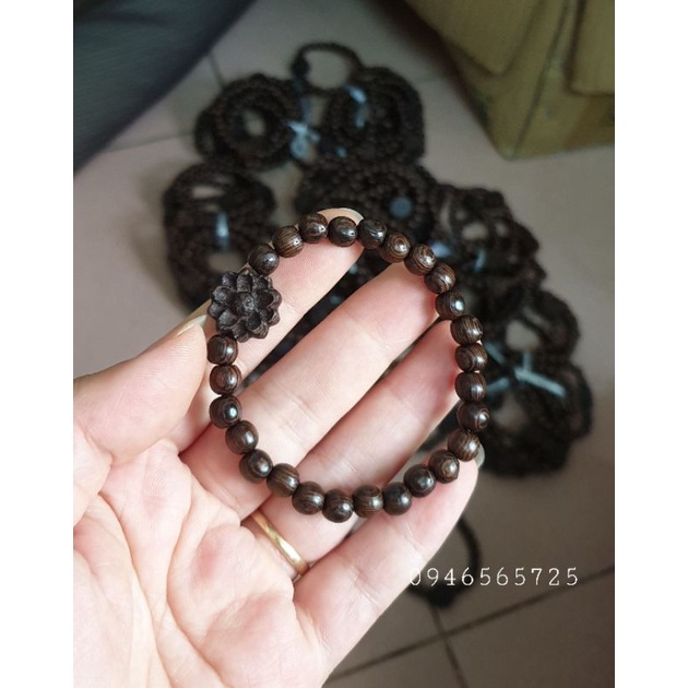 Vòng tay gỗ mun đuôi công mic hoa sen