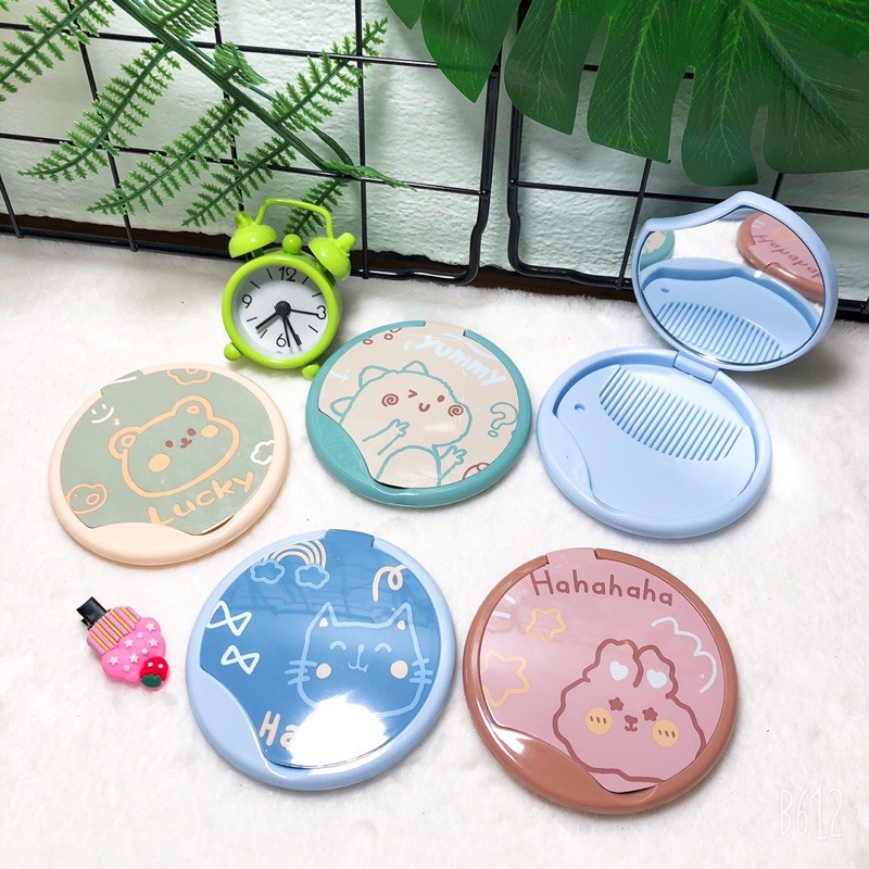 Gương lược tròn bỏ bóp 8cm 134 .