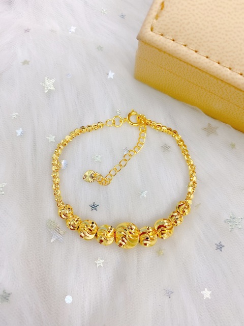 Lắc bi mạ vàng
