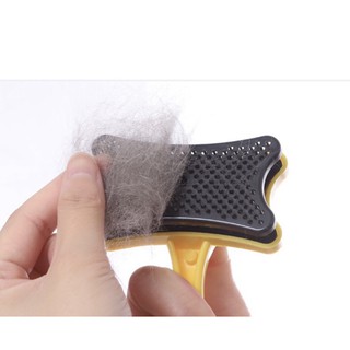 Bàn chải chó mèo có nút lấy lông